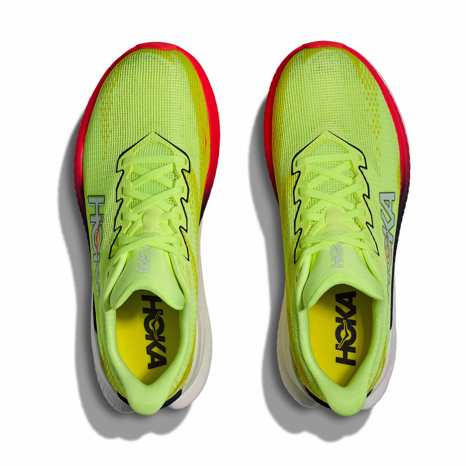 The uppers of a pair of HOKA Women's Mach X 3 Running Shoes in the Neon Yuzu/Squid Ink colourway.