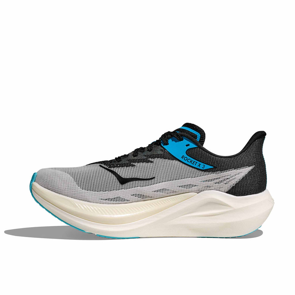 Medial view of the right shoe from a pair of HOKA Unisex Rocket X 3 Running Shoes in the White/Black colourway. (8689387602082)