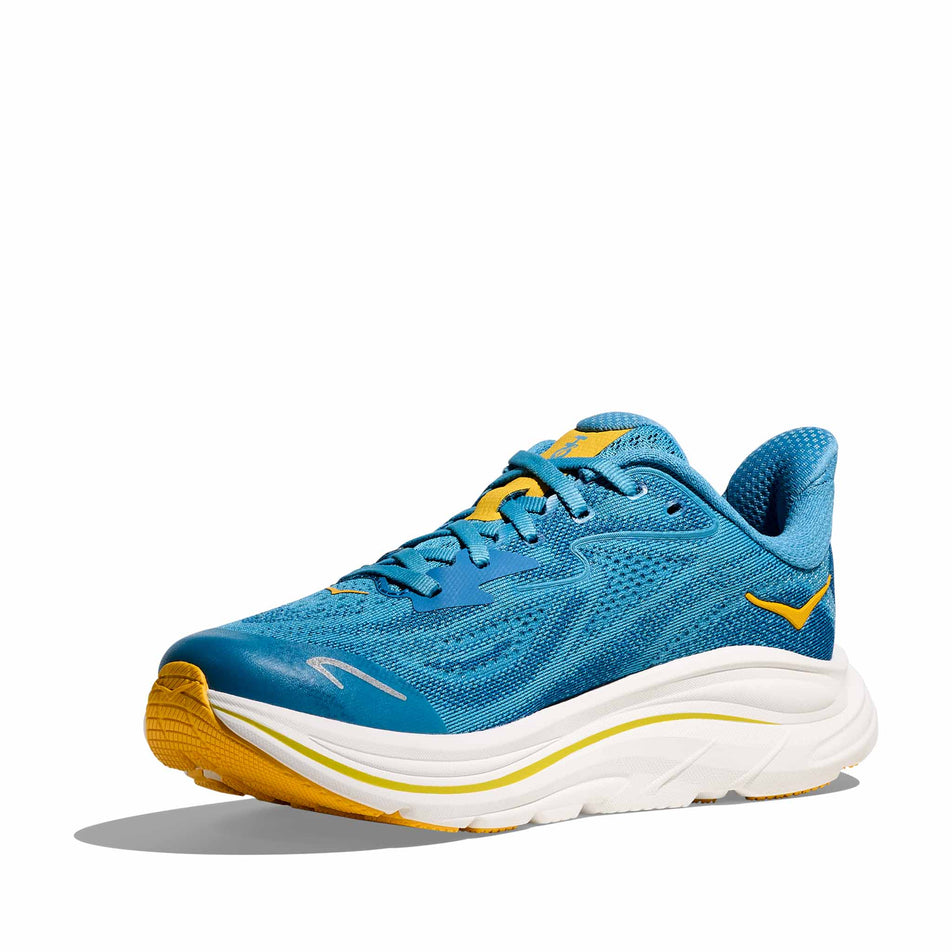 Medial view of the right shoe from a pair of HOKA Clifton 10 Big Kids Running Shoes in the Alpine Blue/Foggy Night colourway.