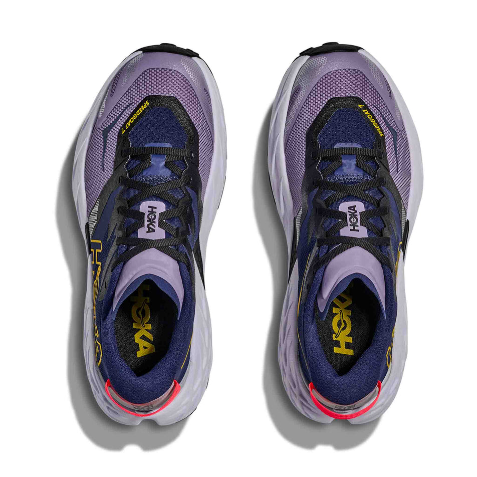 The uppers of a pair of HOKA Women's Speedgoat 7 Running Shoes in the Berry Jam/Starlight Glow colourway.