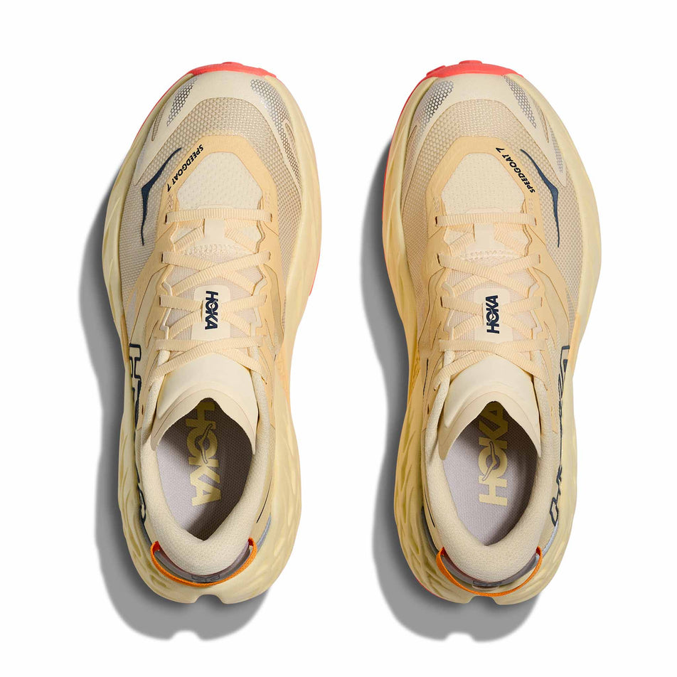 The uppers of a pair of HOKA Women's Speedgoat 7 Running Shoes in the Vintage Yellow/Neon Flame colourway.