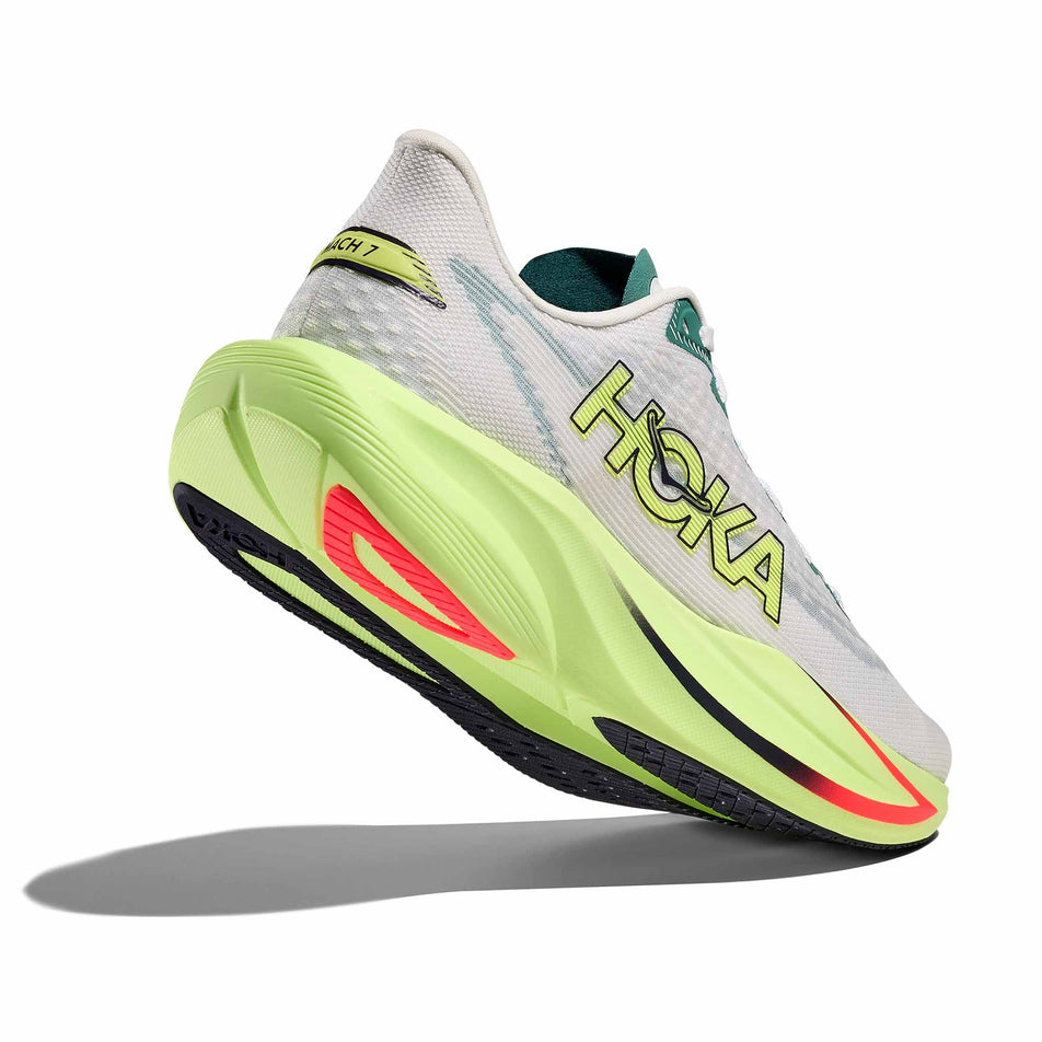 Lateral - and outsole - view of the right shoe from a pair of HOKA Women's Mach 7 Running Shoes in the Frost/Neon Yuzu colourway.