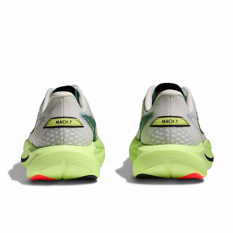 The back of a pair of HOKA Women's Mach 7 Running Shoes in the Frost/Neon Yuzu colourway.