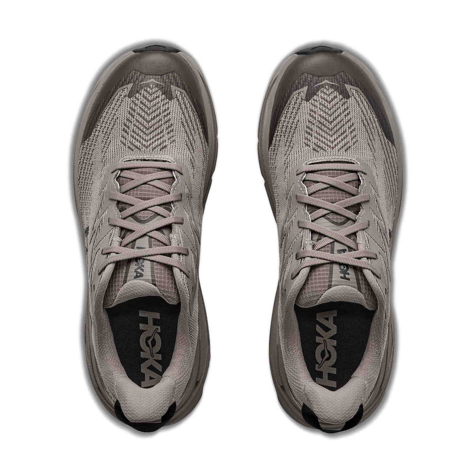 The uppers of a pair of HOKA Men's Challenger 8 GTX Trail Running Shoes in the Pebble Grey/Boulder Grey colourway.