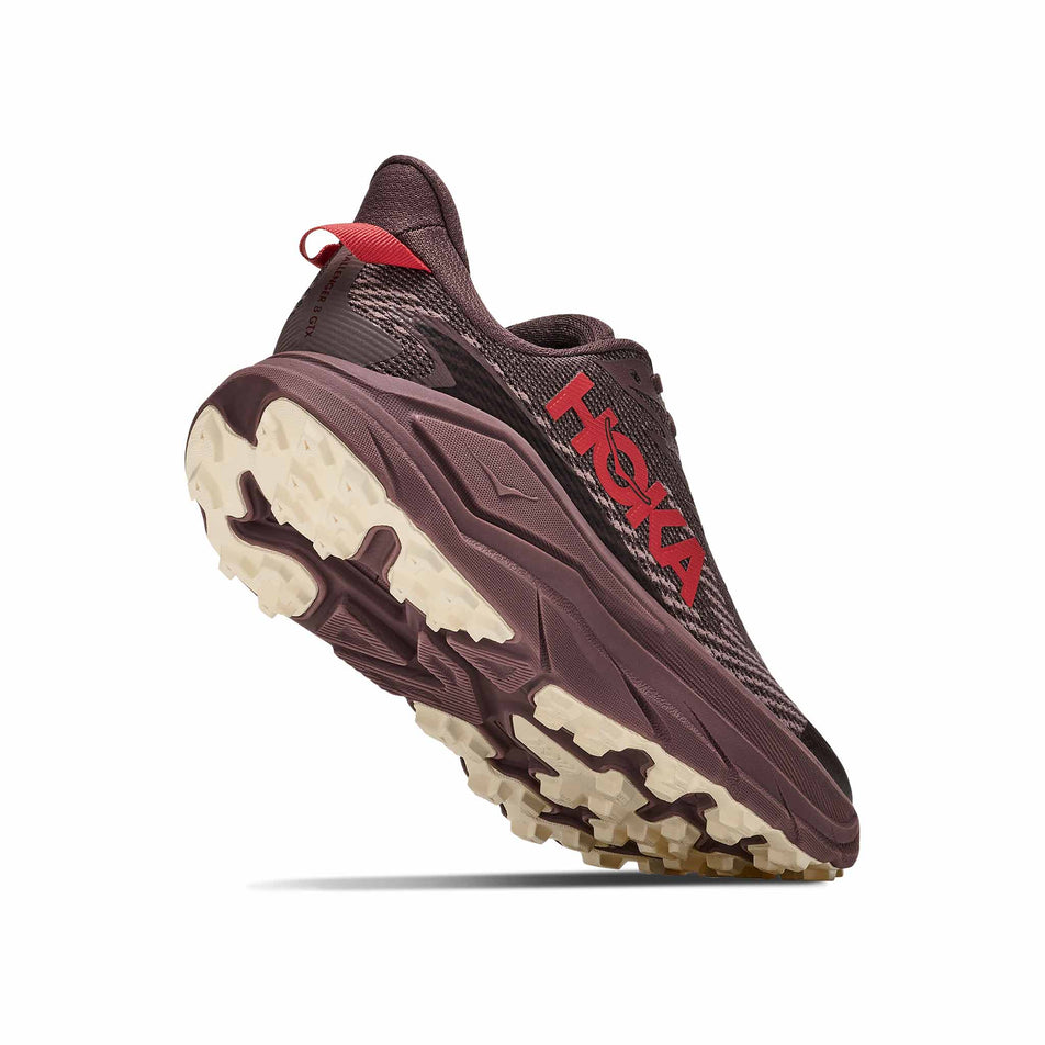 Lateral - and outsole - view of the right shoe from a pair of HOKA Women's Challenger 8 GTX Trail Running Shoes in the Smoky Quartz/Alabaster colourway.