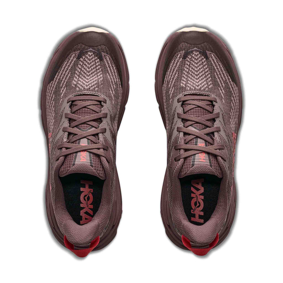 The uppers of a pair of HOKA Women's Challenger 8 GTX Trail Running Shoes in the Smoky Quartz/Alabaster colourway.