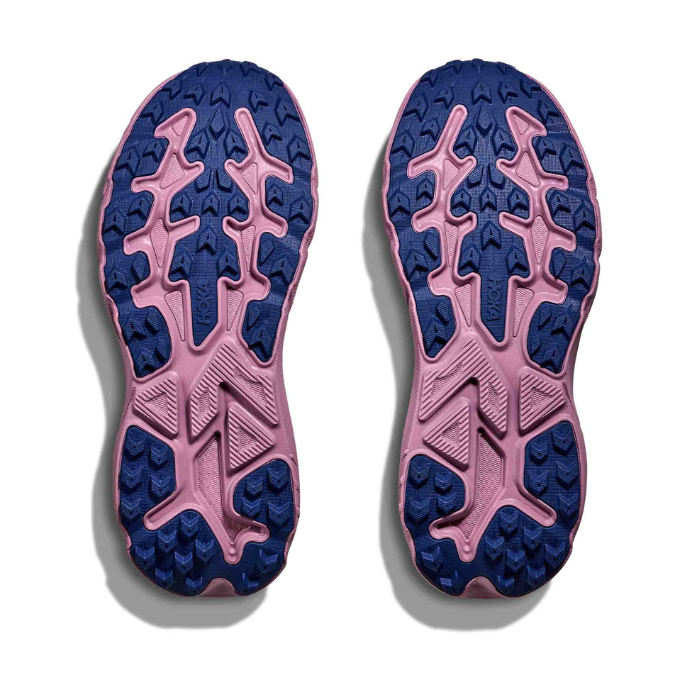 The outsoles of a pair of HOKA Women's Challenger 8 GTX Running Shoes in the Fragrant Lilac/Berry Mauve colourway.
