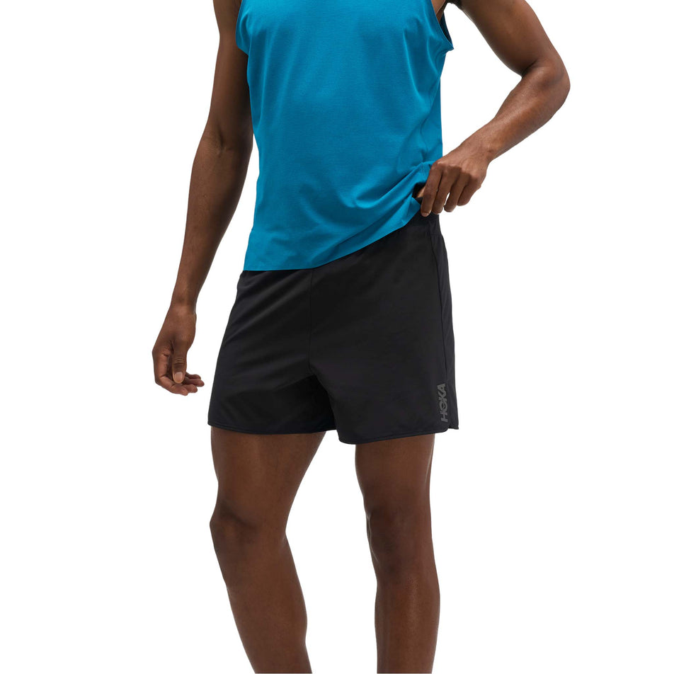 Front view of a model wearing the HOKA Men's Glide Shorts 5