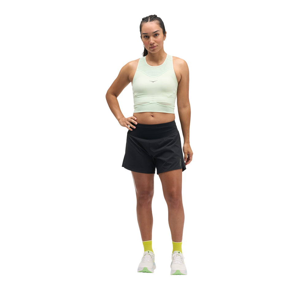 Front view of a model wearing the HOKA Women's Glide Short Mid-Rise 5