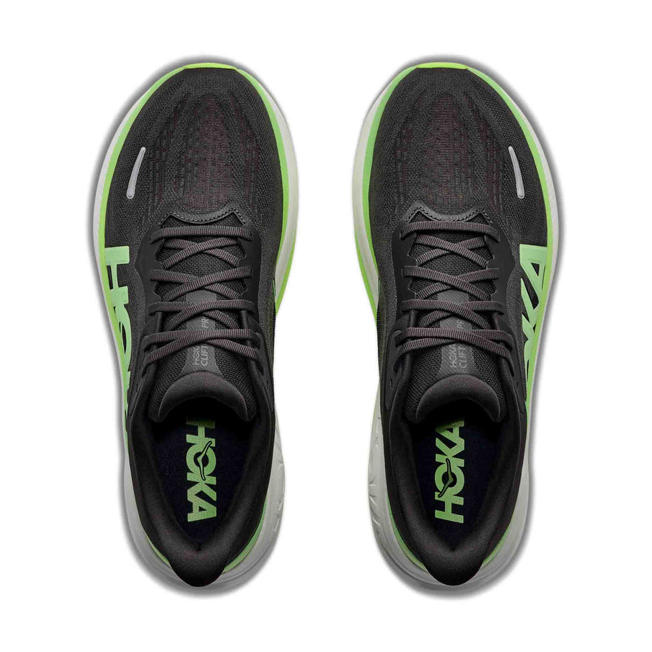 The uppers of a pair of HOKA Men's Clifton Pro Running Shoes in the Carbon Black/Tart Apple colourway.