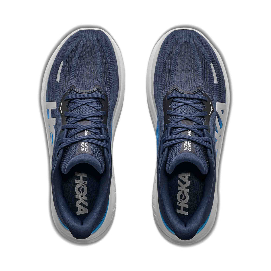 The uppers of a pair of HOKA Men's Clifton Pro Running Shoes in the Varsity Navy/Soft Cobalt colourway.