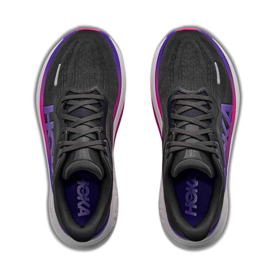 The uppers of a pair of HOKA Women's Clifton Pro Running Shoes in the Carbon Black/Cosmic Purple colourway.