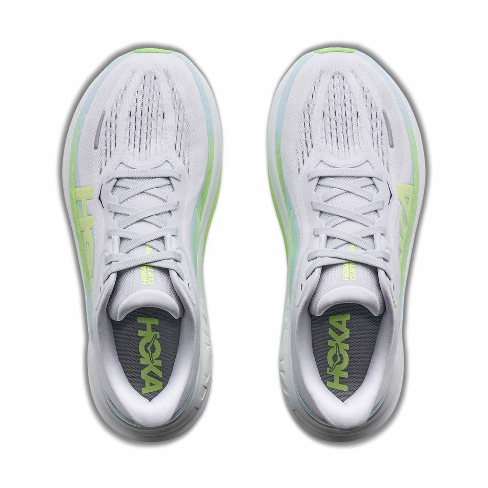 The uppers of a pair of HOKA Women's Clifton Pro Running Shoes in the Cosmic Grey/Neon Yuzu colourway.