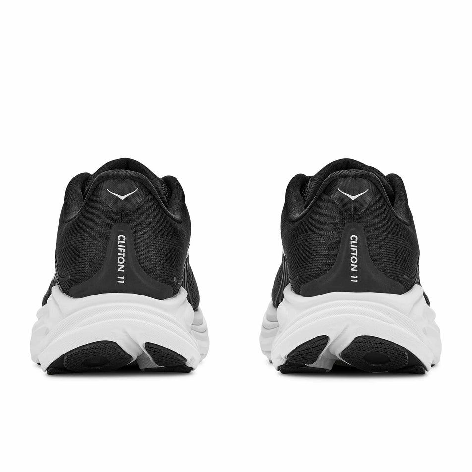 The back of a pair of HOKA Women's Clifton 11 Running Shoes in the Black/White colourway.