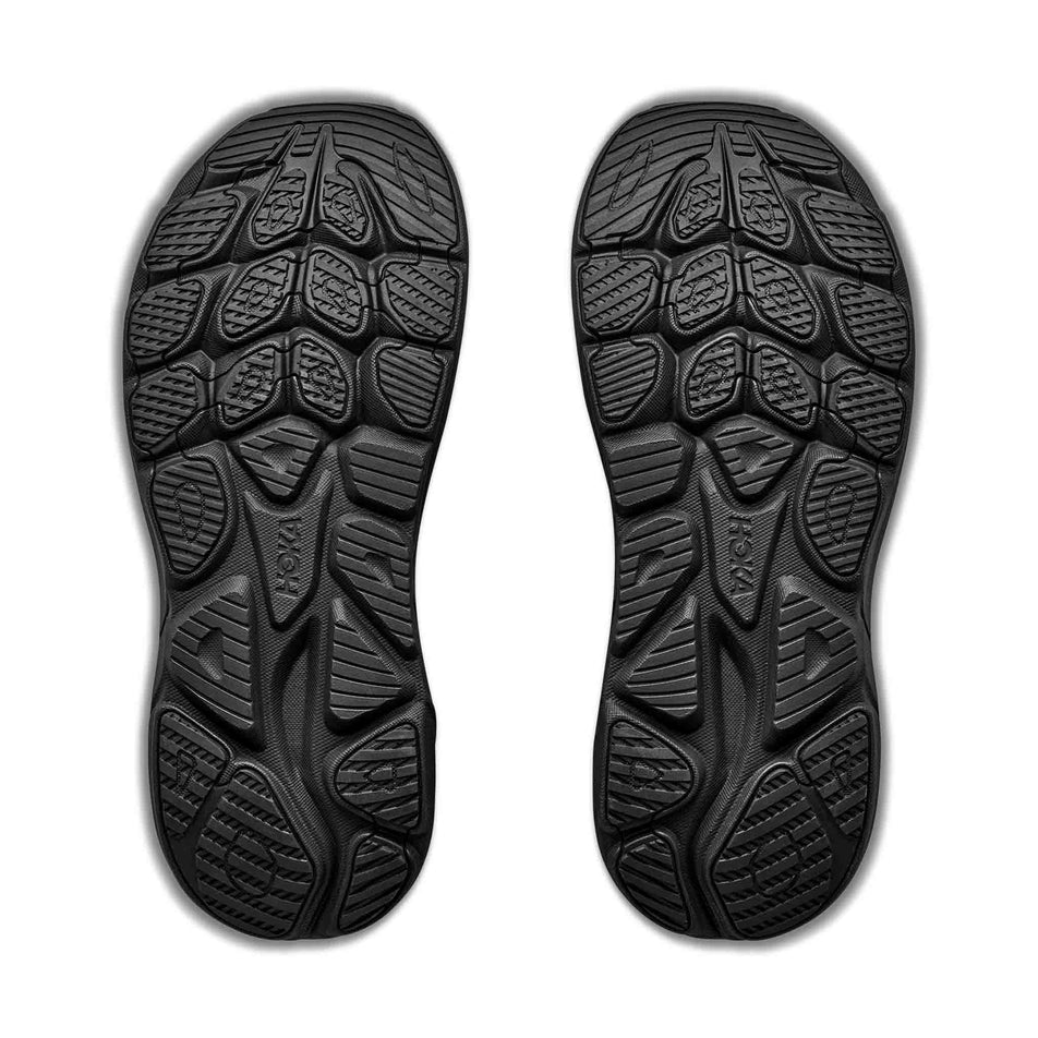 The outsoles of a pair of HOKA Men's Clifton 11 GTX Running Shoes in the Black/Black colourway.
