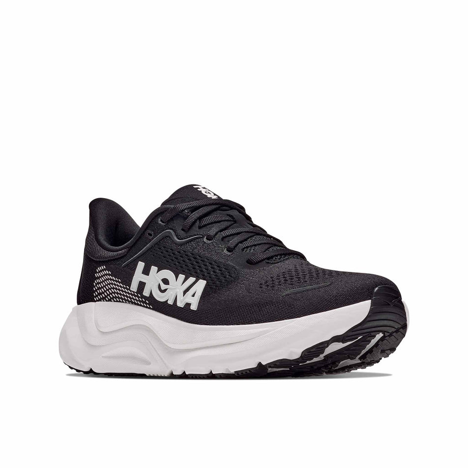 Lateral view of the right shoe from a pair of HOKA Men's Arahi 9 Wide Running Shoes in the Black/White colourway.