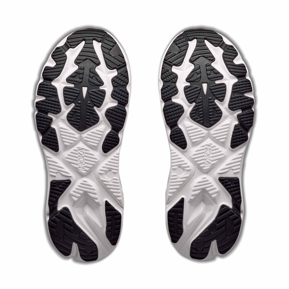 The outsoles of a pair of HOKA Men's Arahi 9 Wide Running Shoes in the Black/White colourway.