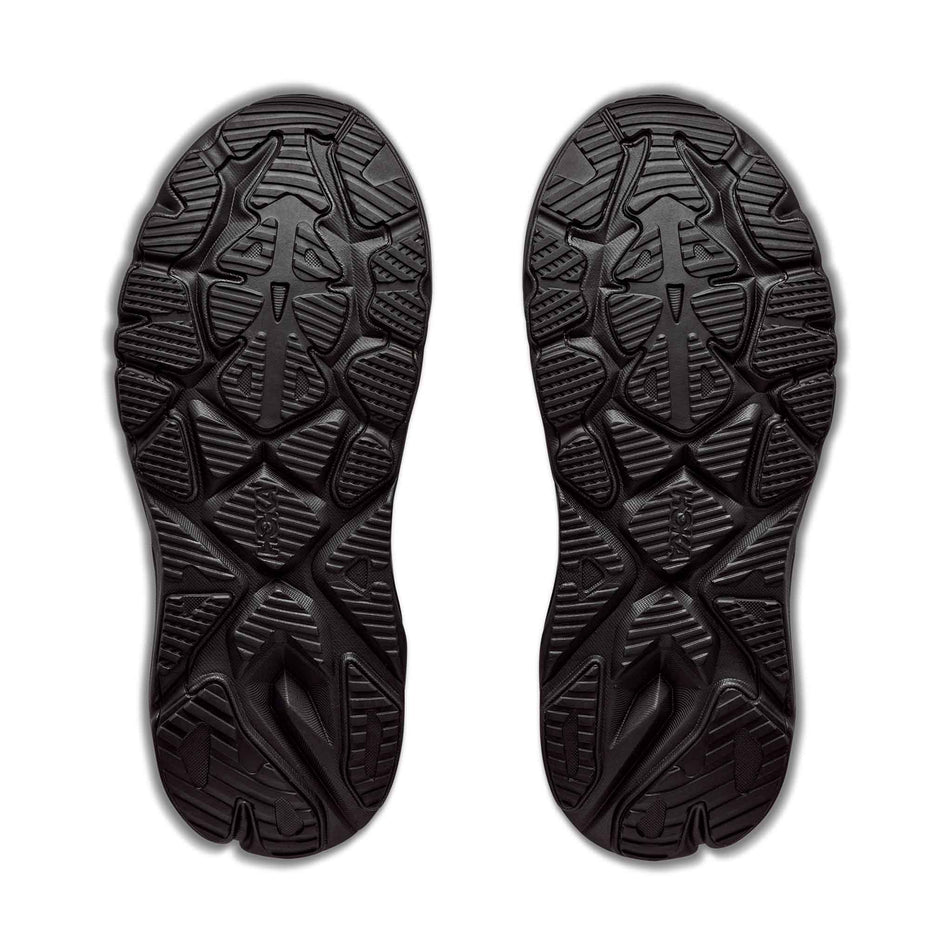 The outsoles of a pair of HOKA Women's Arahi 9 Wide Running Shoes in the Black/Black colourway.