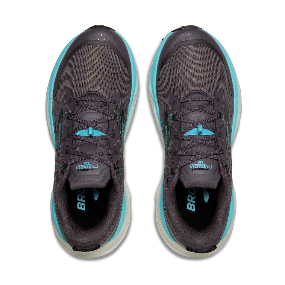 The uppers of a pair of Brooks Women's Cascadia 19 Running Shoes in the Rabbit/Black/Bluefish colourway.