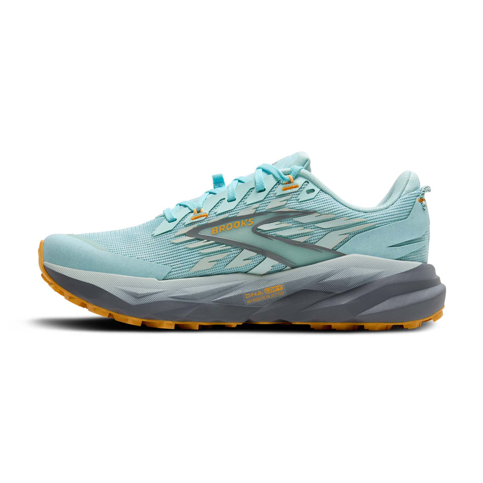 Medial view of the right shoe from a pair of Brooks Women's Cascadia 19 Running Shoes in the Clearwater/Primer Grey/Apricot colourway. (8655856599202)