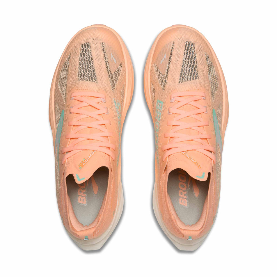 The uppers of a pair of Brooks Women's Hyperion Max 3 Running Shoes in the Coral/Yucca/Coconut colourway.