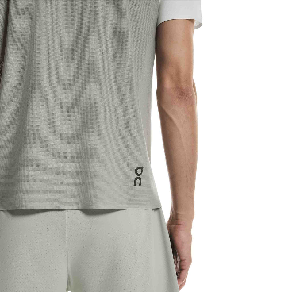 Back view of a model wearing the On Men's Performance-T in the Iceberg/Tin colourway.
