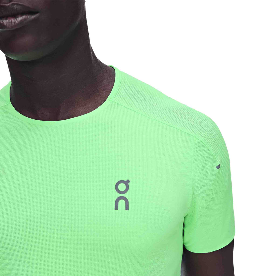 Front view of a model wearing the On Men's Performance-T in the Verdite/Apollo colourway.