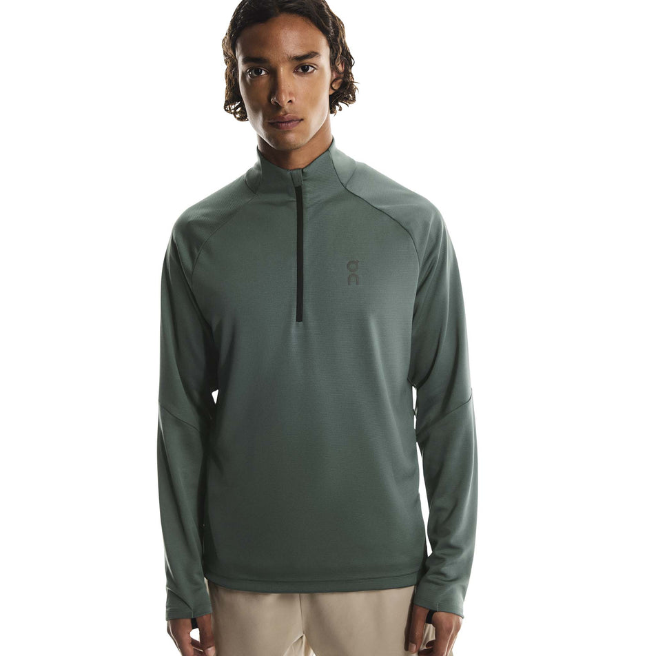 Front view of a model wearing the On Men's Climate Shirt in the Olive colourway. (8790094643362)