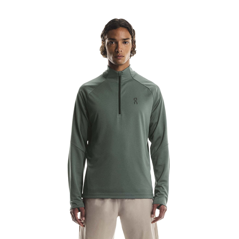 Front view of a model wearing the On Men's Climate Shirt in the Olive colourway. (8790094643362)