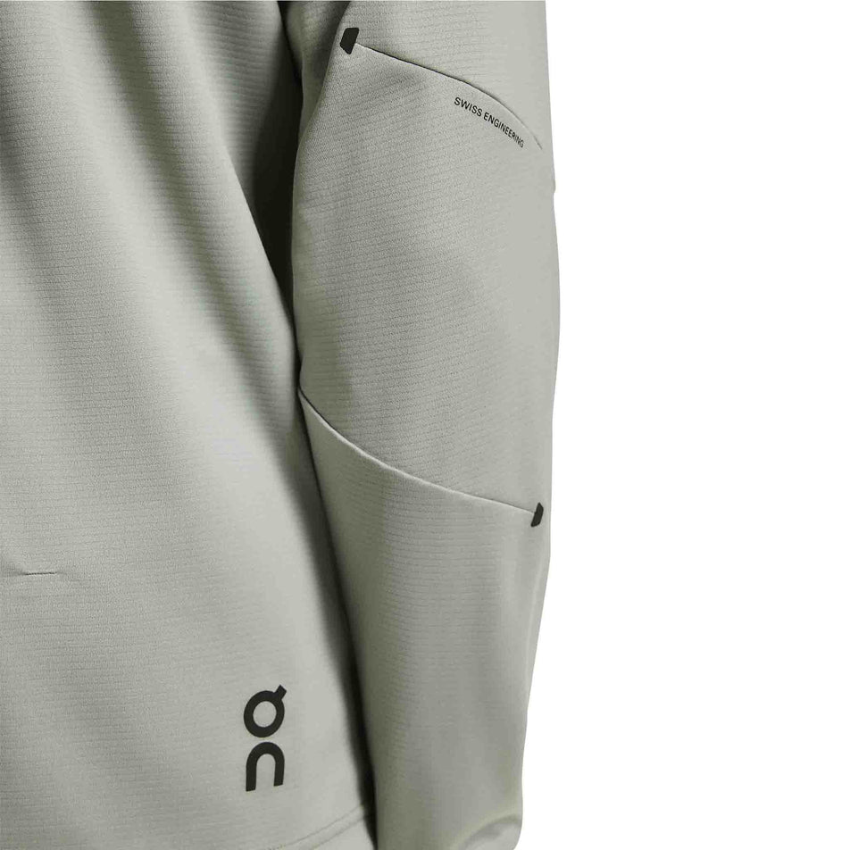 Close-up view of the back of the sleeve of the On Men's Climate Shirt in the Tin colourway.