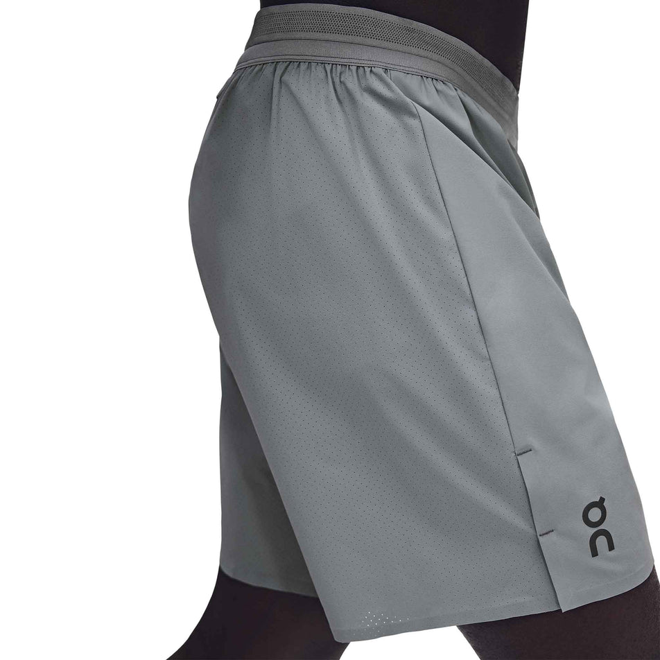 Side view of a model wearing the On Men's 7