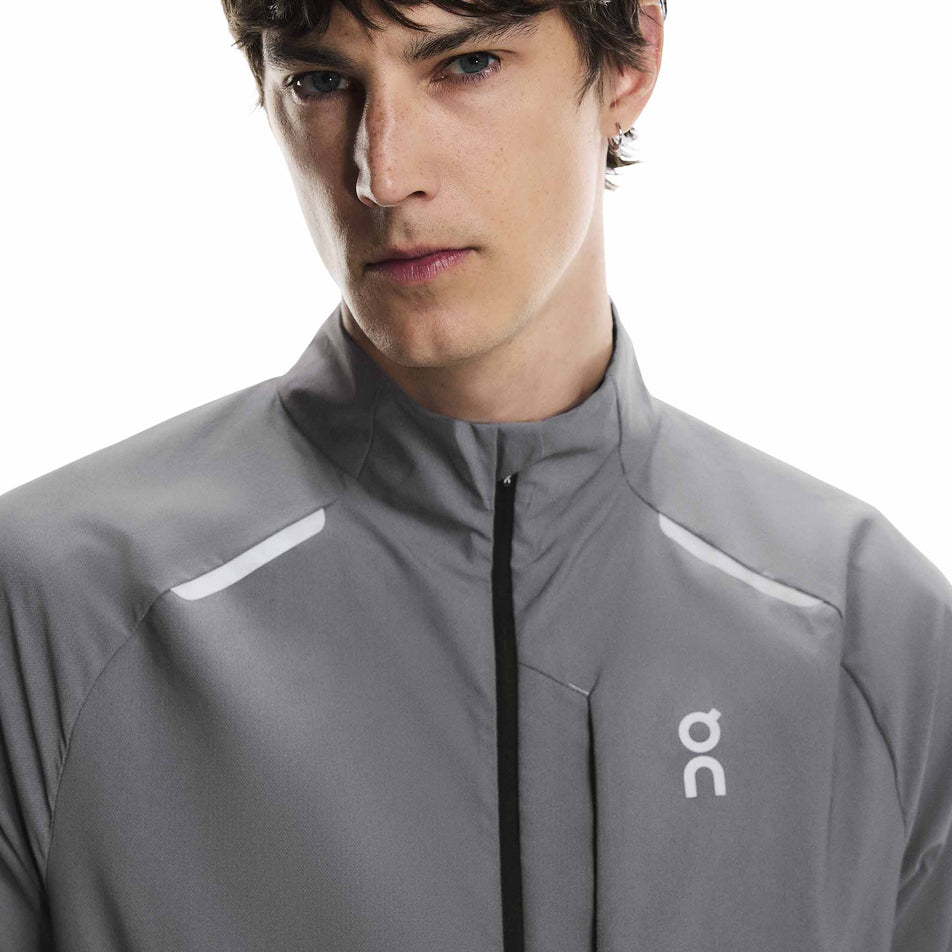 Front view of a model wearing the On Men's Weather Jacket Lumos in the Eclipse colourway. (8790125510818)