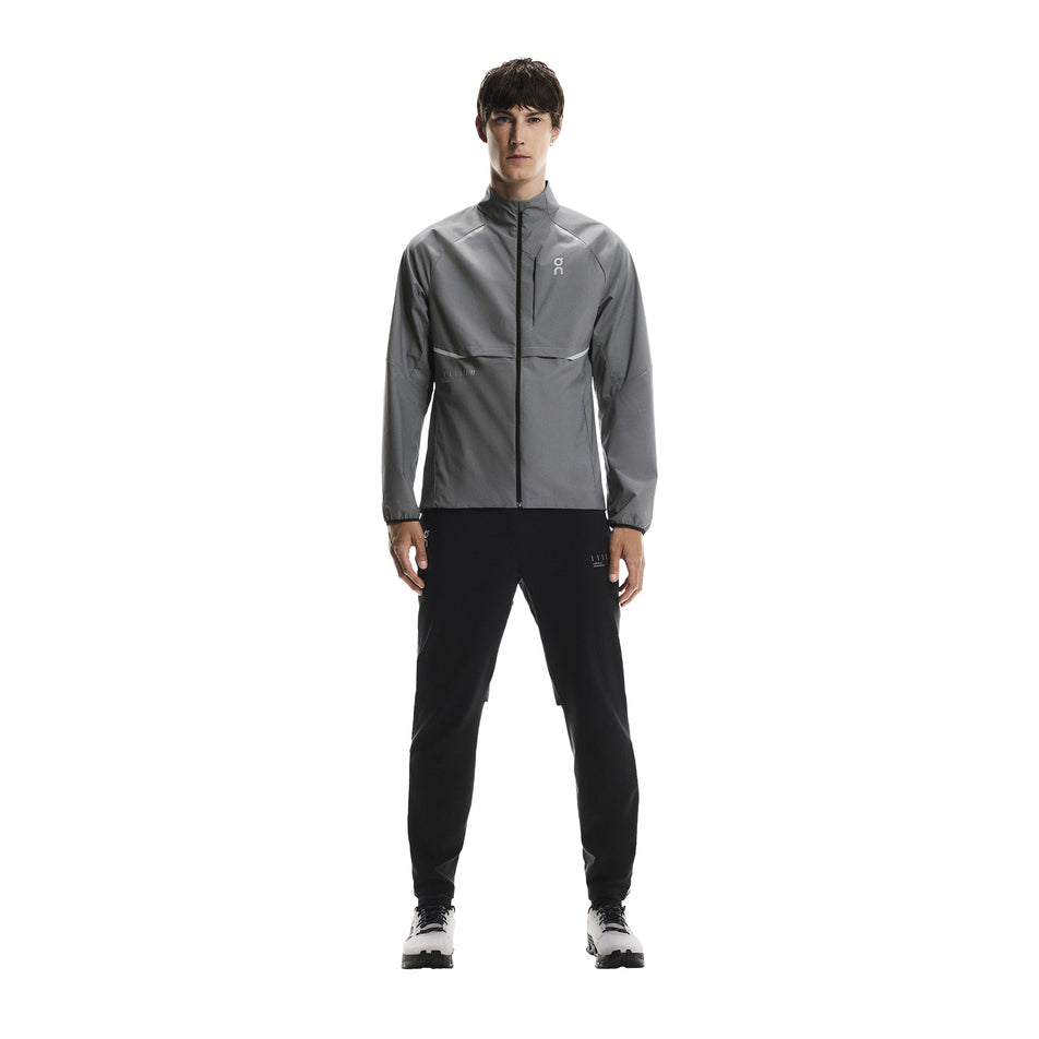 Front view of a model wearing the On Men's Weather Jacket Lumos in the Eclipse colourway. (8790125510818)
