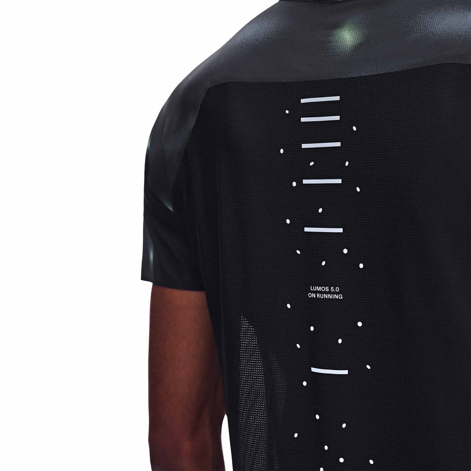 Back view of a model wearing the On Men's Performance-T Lumos 2.0 in the Black colourway.