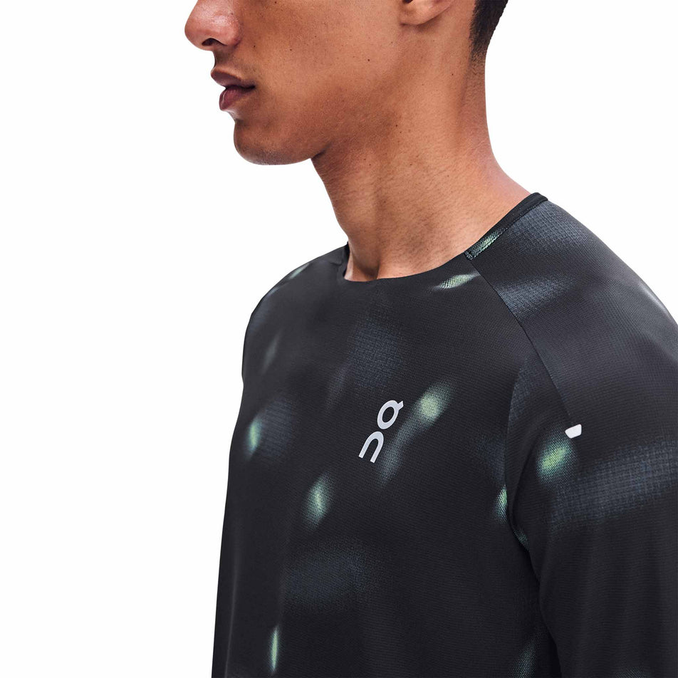 Close-up view of the chest of the On Men's Performance Long-T Lumos 3.0 in the Black colourway.