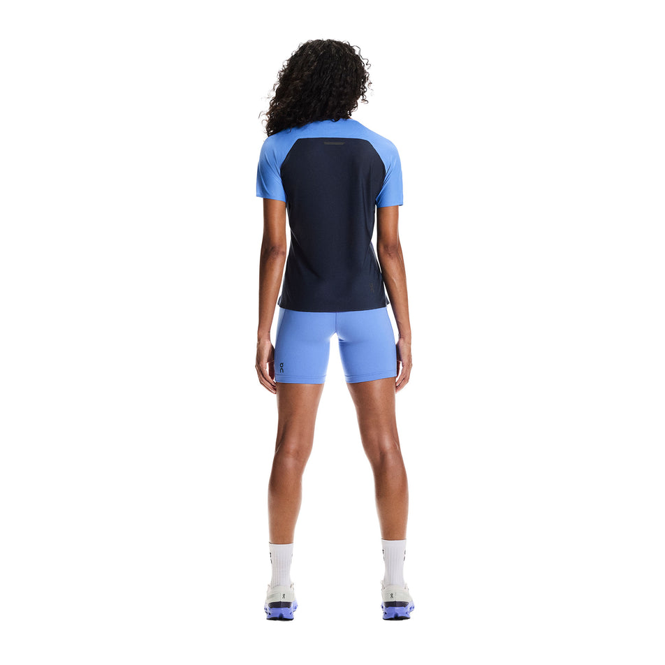 Back view of a model wearing the On Women's Performance-T in the Sailor/Navy colourway.