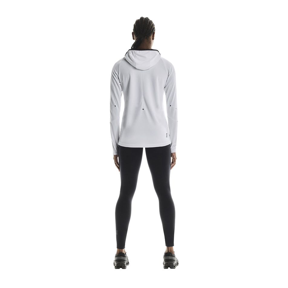 Back view of a model wearing the On Women's Climate Zip Hoodie in the White colourway.