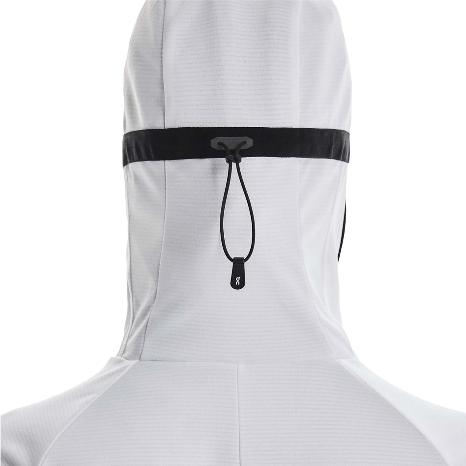 Back view of a model wearing the On Women's Climate Zip Hoodie in the White colourway.