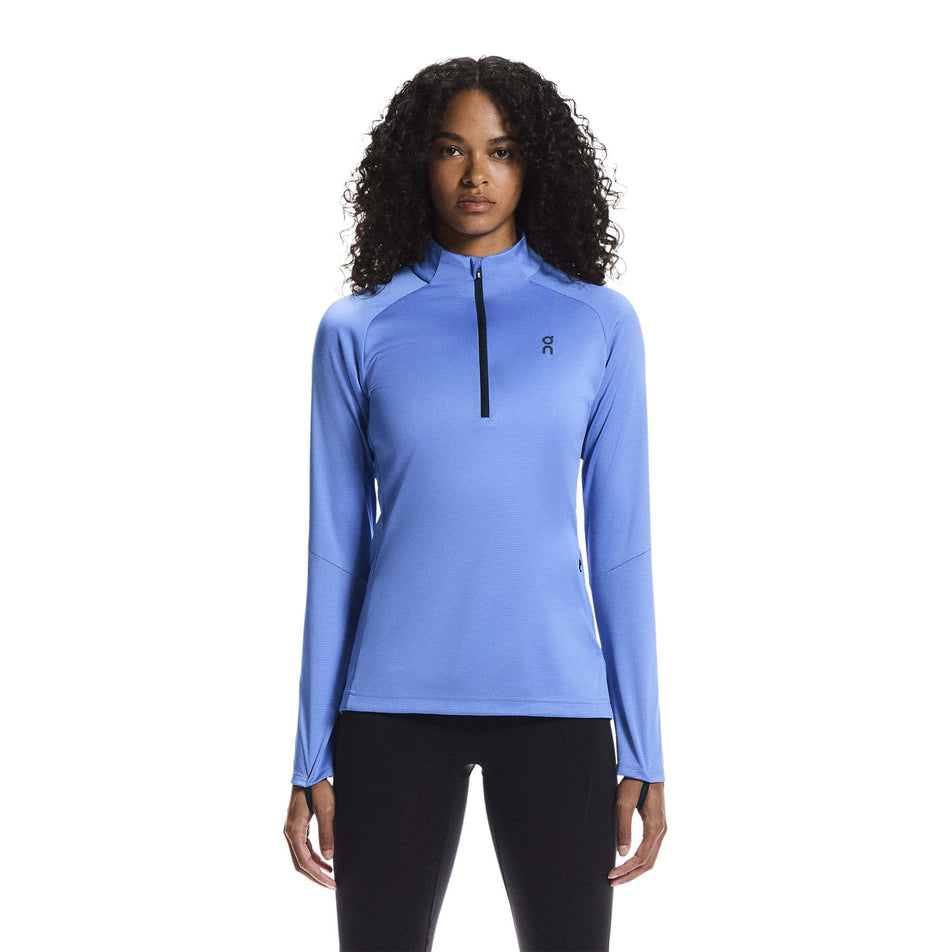 Front view of a model wearing the On Women's Climate Shirt in the Sailor colourway.