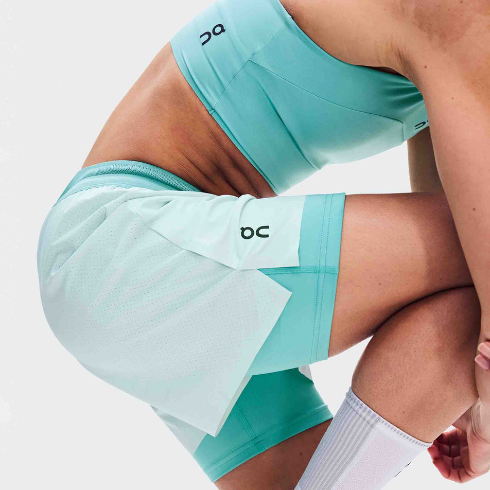 Side view of a model wearing the On Women's 3
