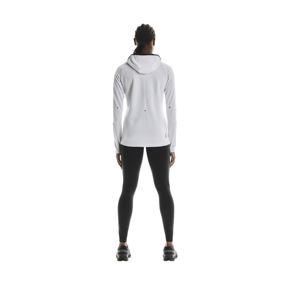 Back view of a model wearing the On Women's Performance Tights in the Black colourway.