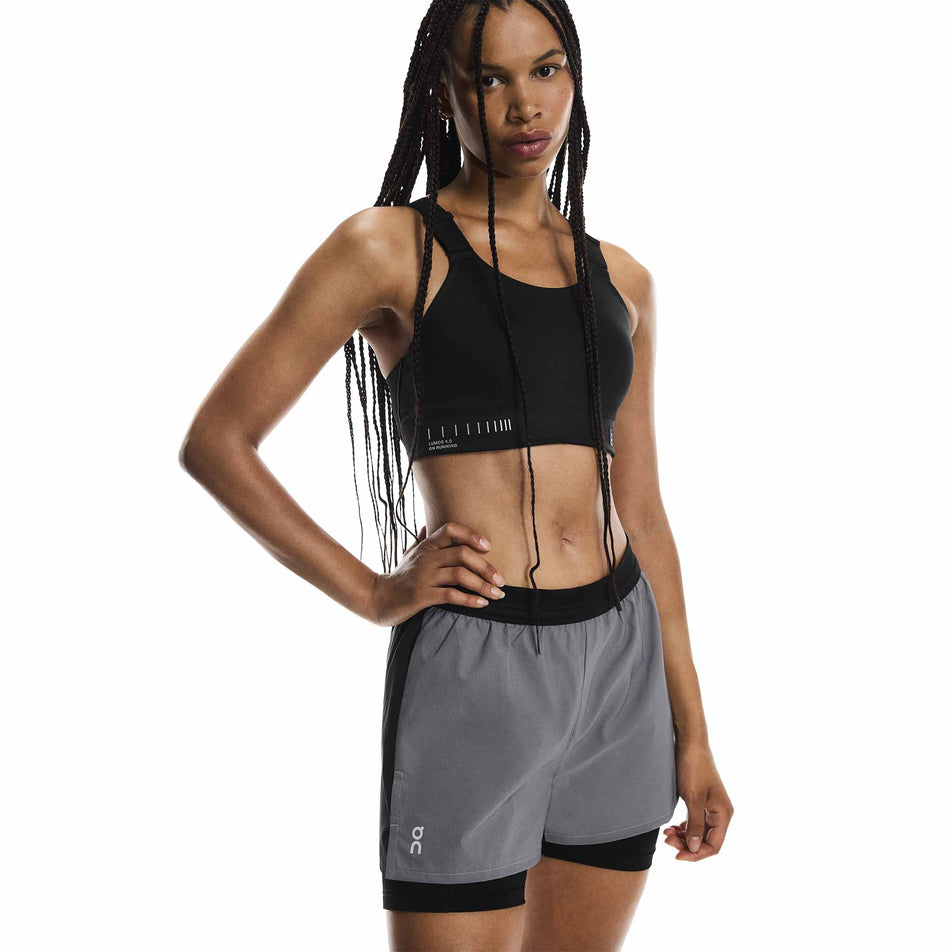 Front view of a model wearing the On Women's Performance Shorts Lumos in the Eclipse/Black colourway. (8790051815586)