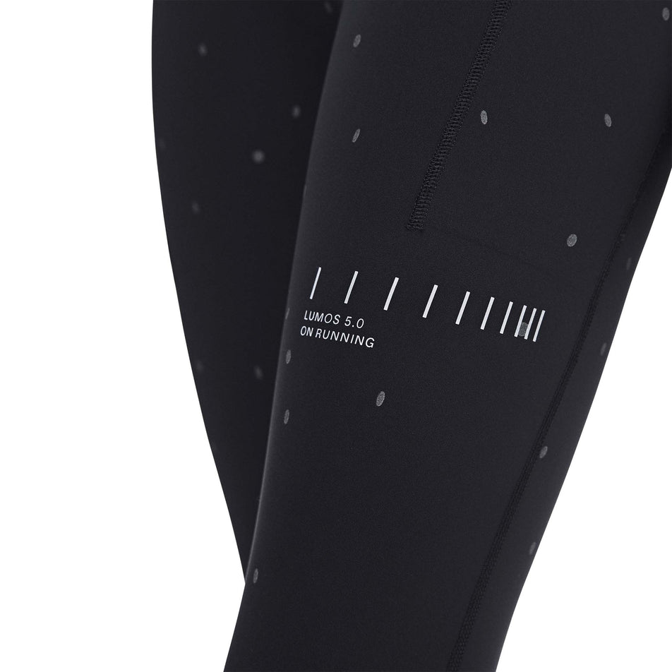 The Lumos branding on the On Women's Performance Tights Lumos 2.0 in the Black/Eclipse colourway.