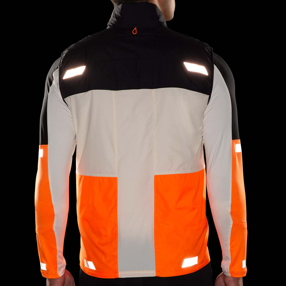 The reflective details on the back of the Brooks Men's Run Visible Insulated Vest 2.0 in the Ecru/Fluoro Flash/Black colourway. (8778447224994)