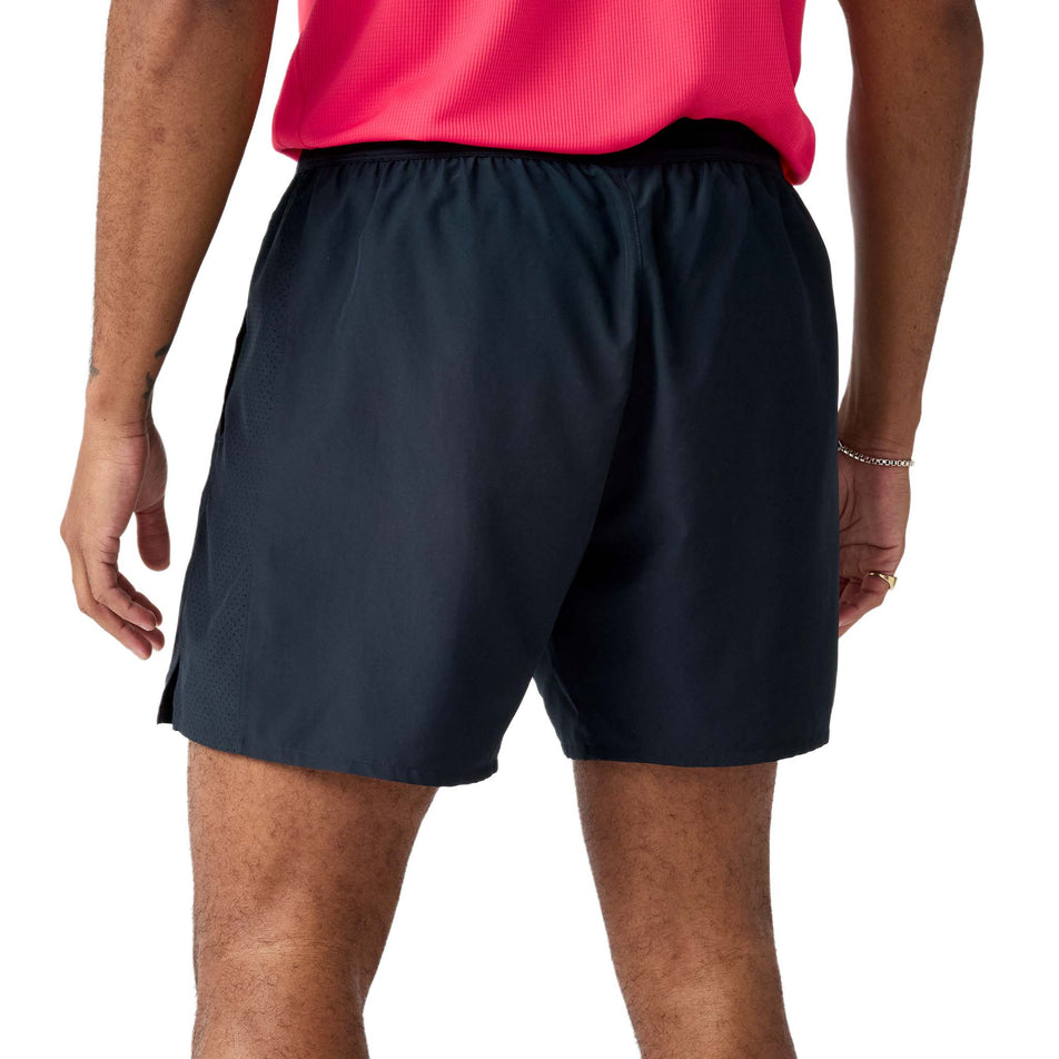 Back view of a model wearing the Brooks Men's Dash 2-in-1 Shorts in the Black colourway.