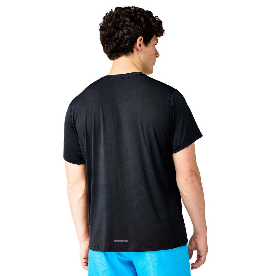 Back view of a model wearing Brooks Men's Dash Cooling Short Sleeve in the Black colourway.