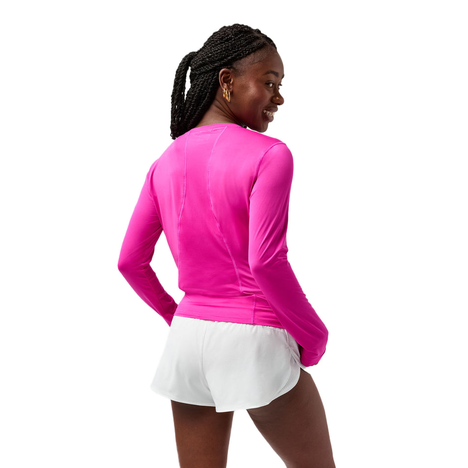 Back view of a model wearing the Brooks Women's Sprint Free Long Sleeve 3.0 in the Magenta colourway. (8718900986018)