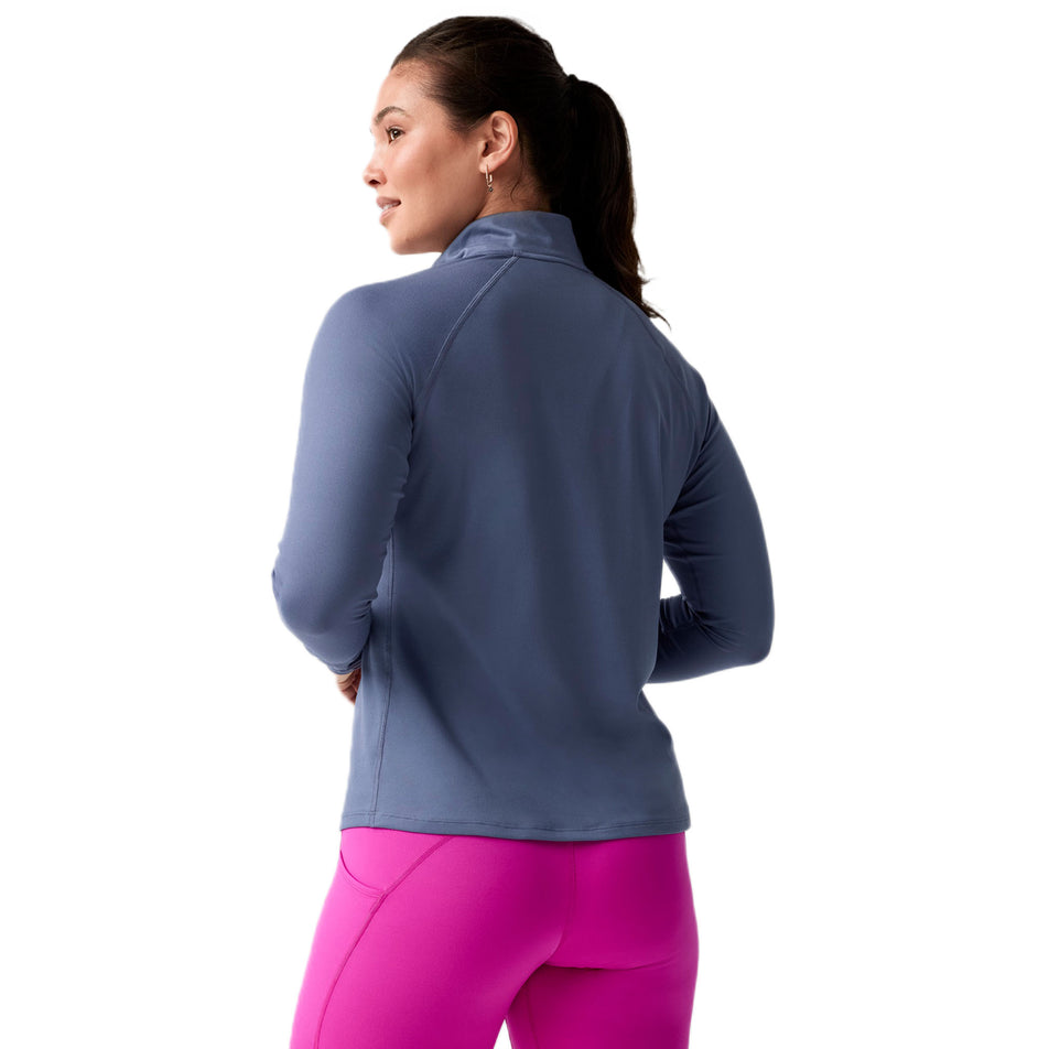 Back view of a model wearing the Brooks Women's Dash 1/2 Zip 3.0 in the Nightshadow colourway. (8718892826786)