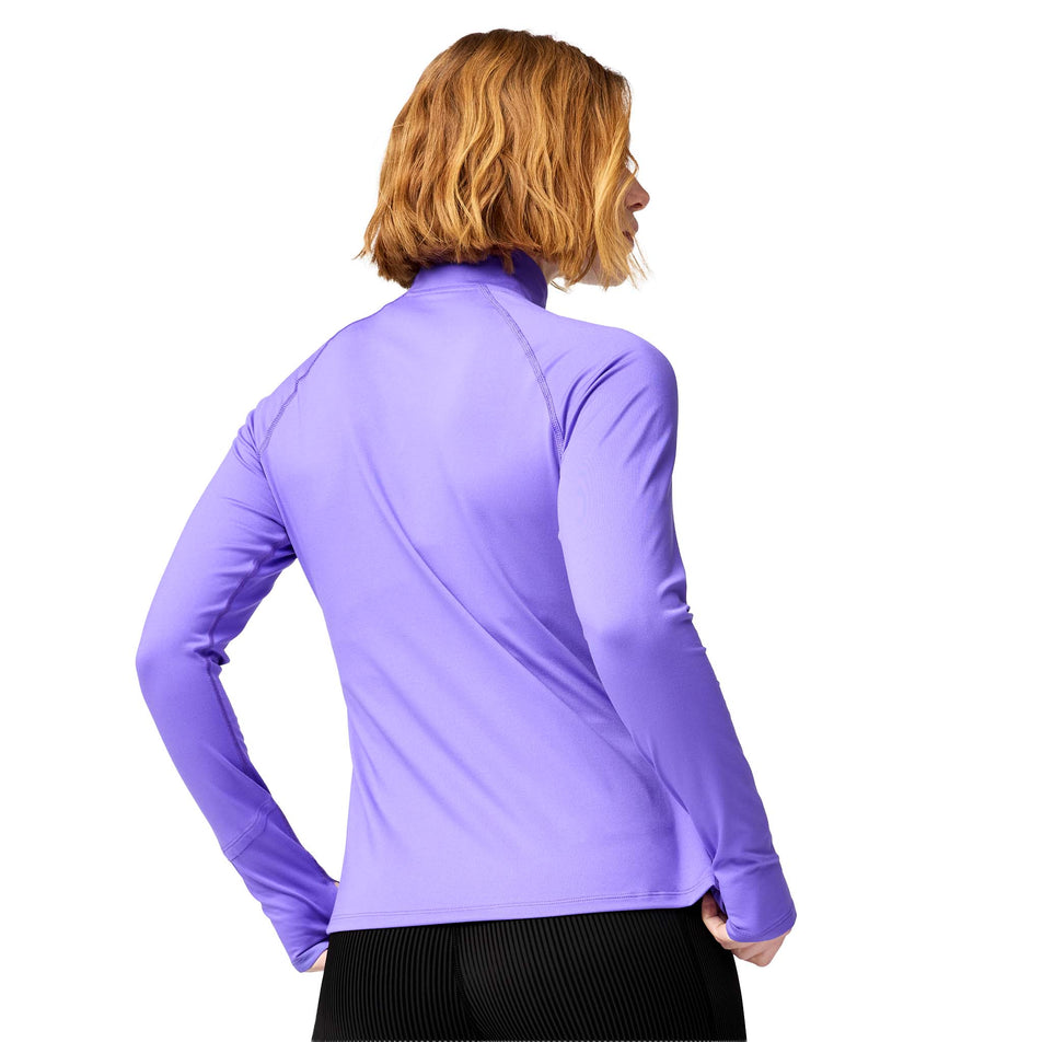Back view of a model wearing the Brooks Women's Dash 1/2 Zip 3.0 in the Violet colourway.