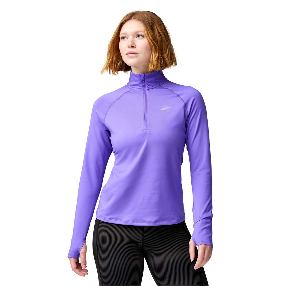 Front view of a model wearing the Brooks Women's Dash 1/2 Zip 3.0 in the Violet colourway.